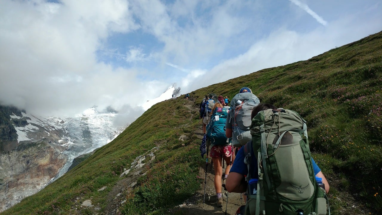 Trekking uphill with a loaded pack helps burn fat effectively. 